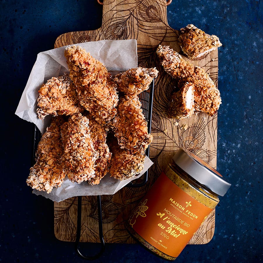 Aiguillettes de poulet panées a la moutarde et le pot de la moutarde bio à l'ancienne au miel Maison Fedon.